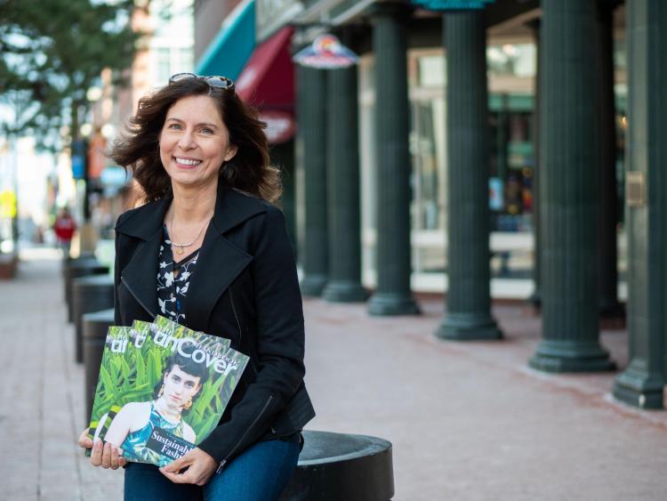 Ana Bogusky poses with her unCover magazine handbook