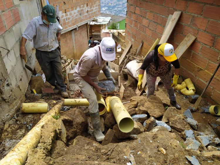 Local residents build a stairway in Medellín, Colombia