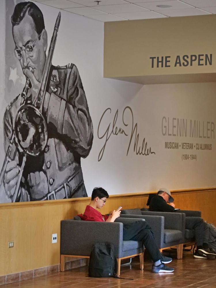 Students relaxing outside the Glenn Miller Ballroom in the UMC