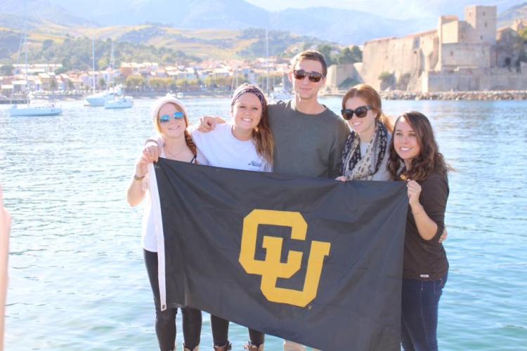 Students pose with a CU flag in France