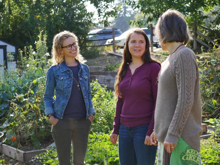 Professor Jill Litt talks with colleagues Erin Decker and Angel Villalobos