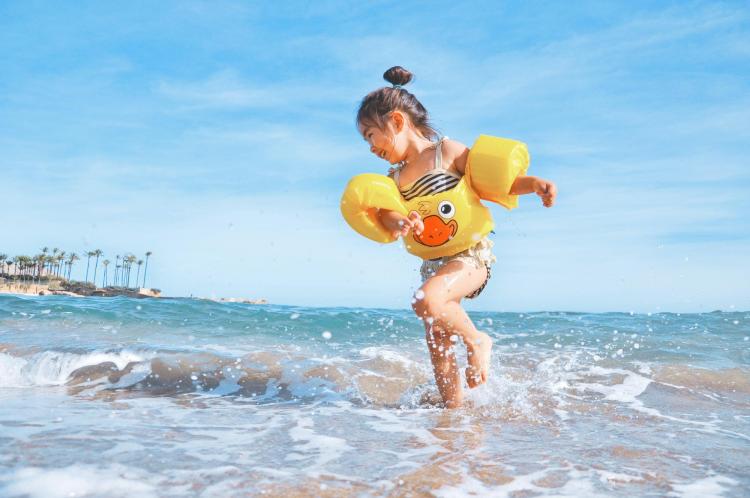 Child playing in the ocean