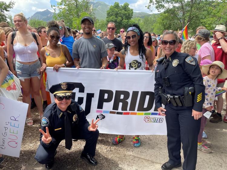 Boulder Police Chief Maris Herold, left, and CUPD Police Chief Doreen Jokerst gather with the community during a Pride Week parade.