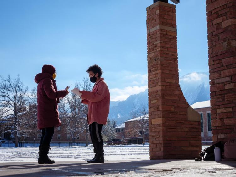 students practicing a play near Farrand Field