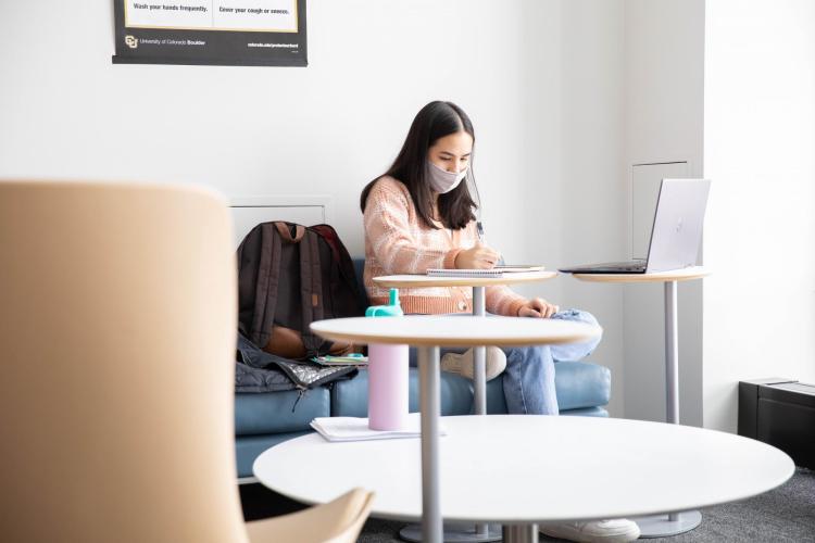 student studying on campus