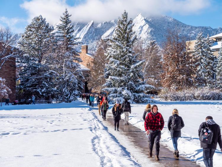 Students walking across a snowy campus