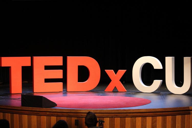 TEDxCU sign on stage