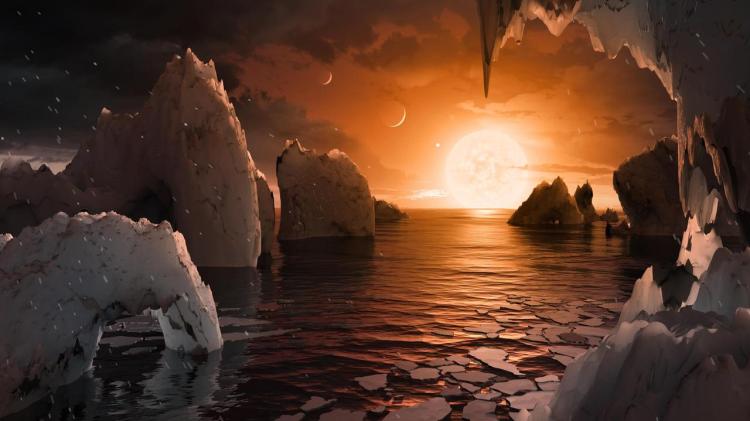 The sun rises over an alien world with water and ice