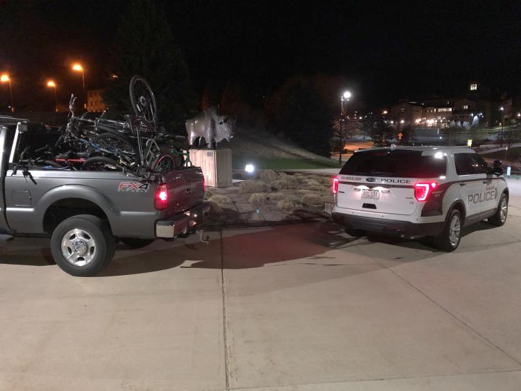 abandoned bikes being collected in the back of a pickup truck