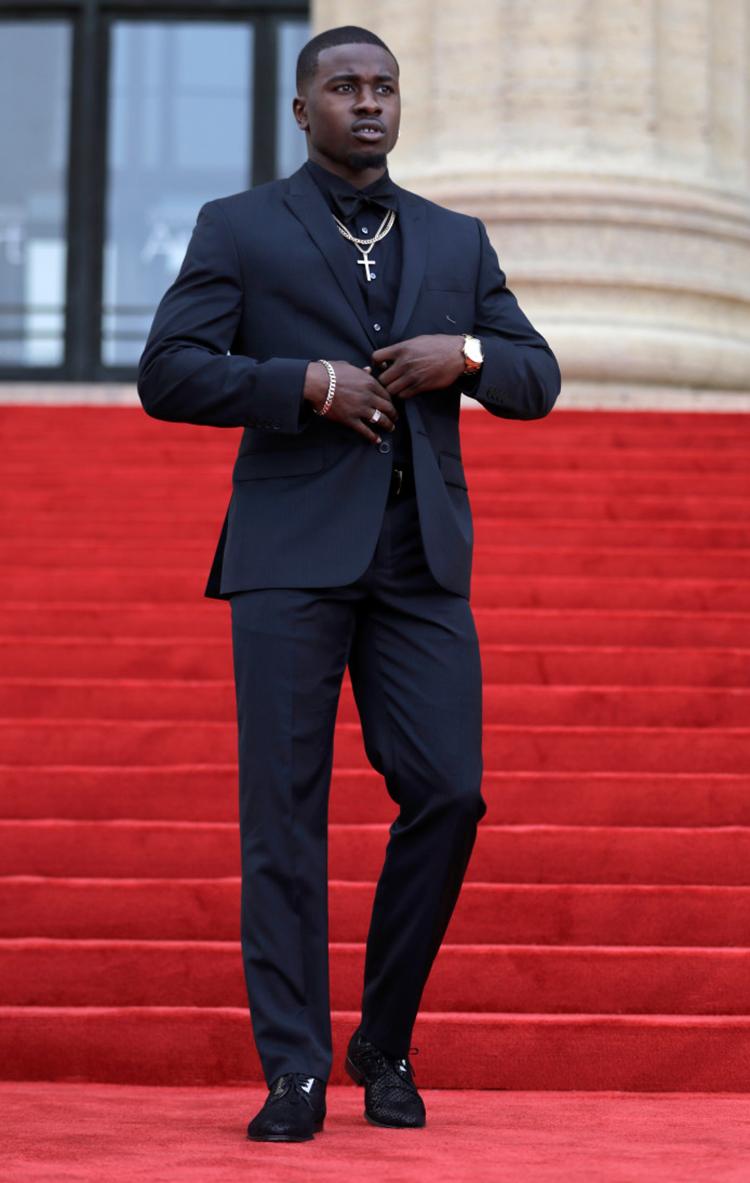 Chidobe Awuzie on red carpet stairs