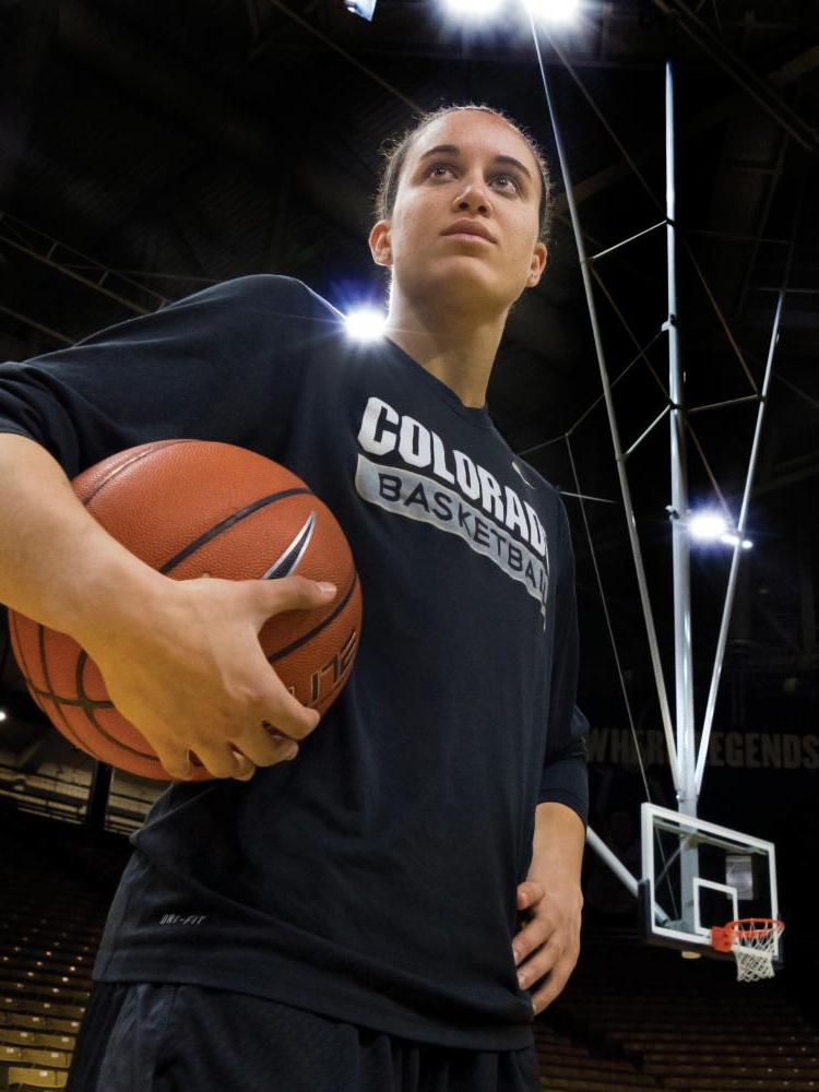 Haley Smith poses with basketball in hand on court