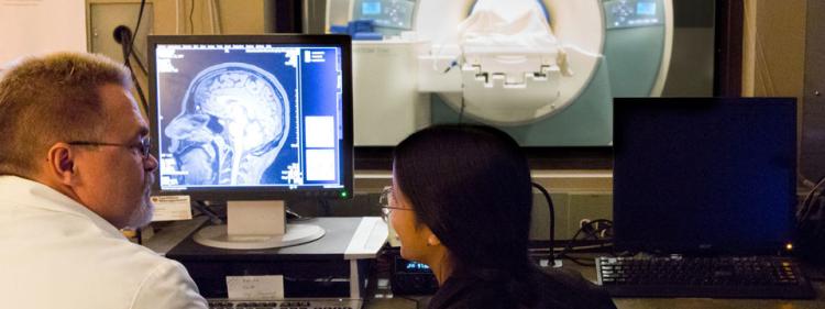 researchers using an MRI scanner