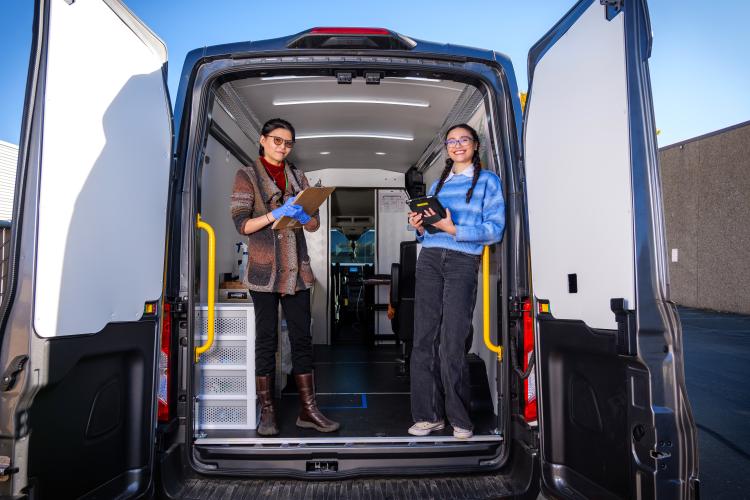 Two researchers open the door to the cannavan