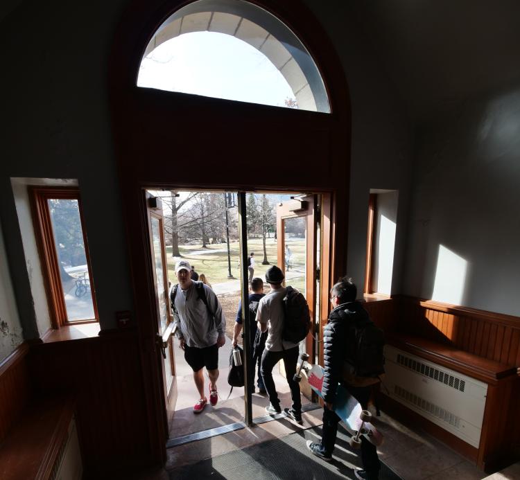 Students file through a doorway in the Hale Science building