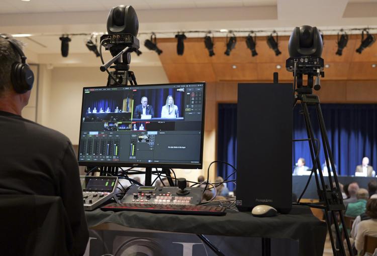 technician recording a livestream during the Conference on World Affairs
