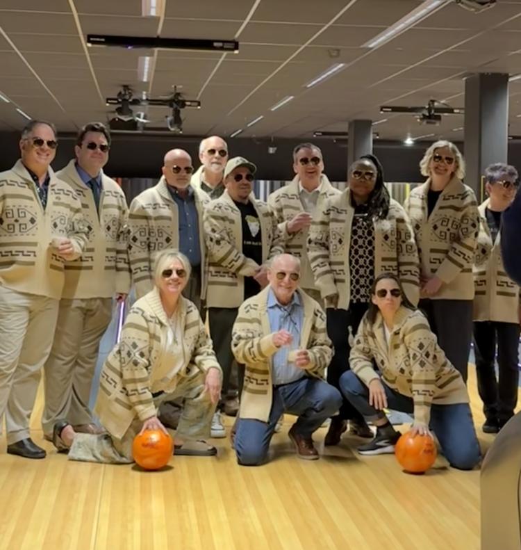 Moore and colleagues at his 'Big Lebowski' themed retirement celebration