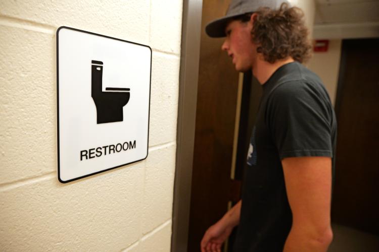 inclusive restroom sign