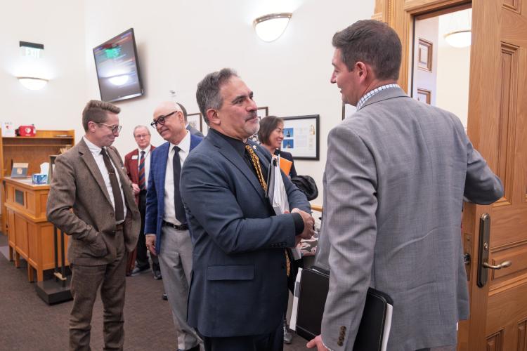 Chancellor Justin Schwartz talks with Chad Marturano, CU system vice president and chief financial officer