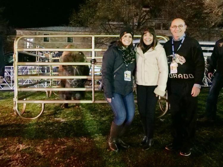 Chancellor Phillip DiStefano, right, poses with his wife, Yvonne, and daughter, Nicole, alongside Ralphie V ahead of Colorado's game against Washington on Saturday, Nov. 23, 2019. (Photo by Glenn Asakawa/University of Colorado)