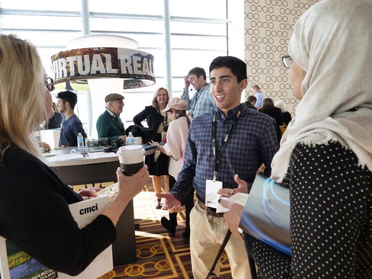 CU Boulder student and Buff Talks speaker Alan Sanchez (AeroEngr'18) chats with particpants. Photo by Glenn Asakawa.