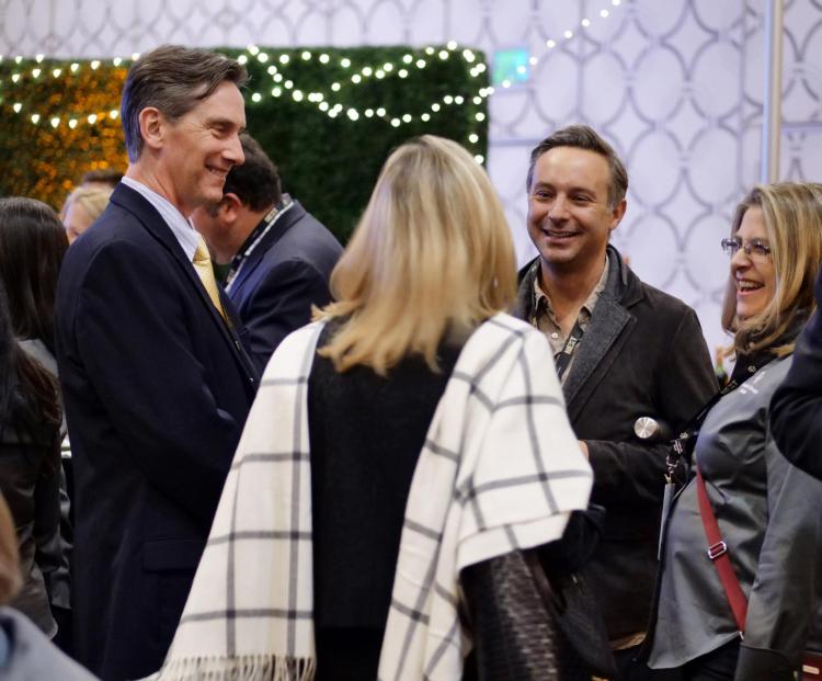 Attendees network with South Park producer/animation director Eric Stough (Film'95) and CU Arts and Sciences Dean James White. Photo by Glenn Asakawa.