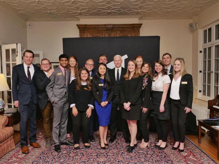 Cooper poses for photo with members of the Distinguished Speakers Board. Photo by Glenn Asakawa.