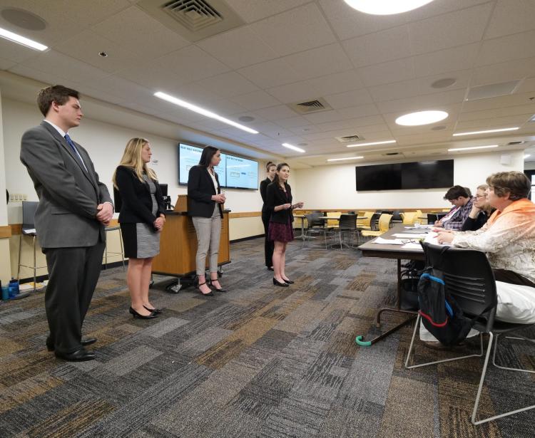 Leeds School of Business undergraduate students make their case in an ethics competition. Photo by Glenn Asakawa.