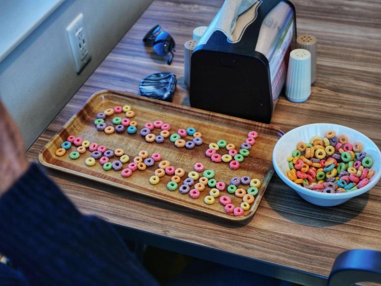 Good morning written in Froot Loops cereal at Village Center. Photo by Glenn Asakawa.