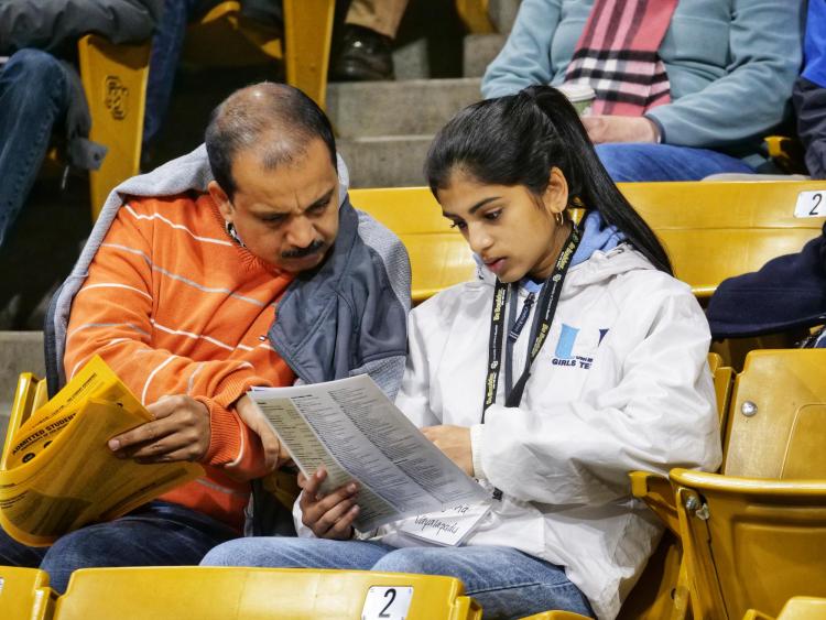 Admitted students and their parents plan out their day. Photo by Glenn Asakawa.