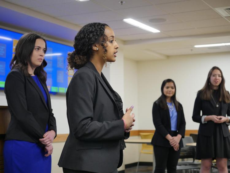 Student talks during her team's Business Ethics Case Competition presentation. Photo by Glenn Asakawa.