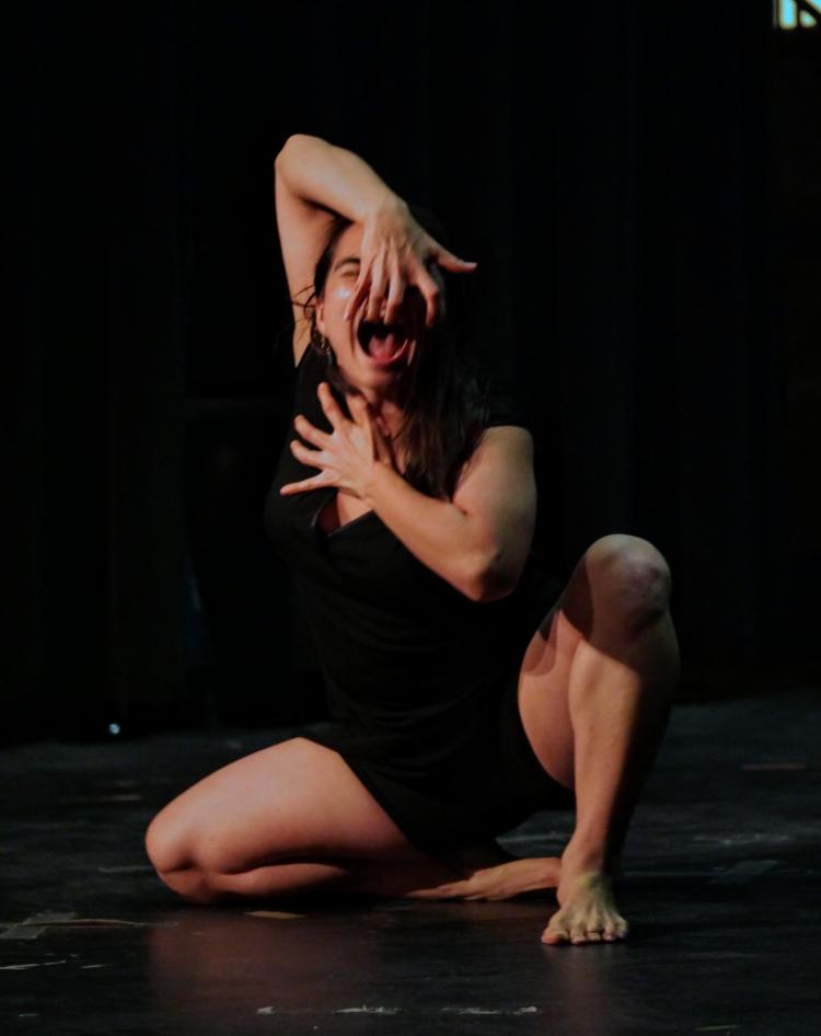 CU Boulder graduate student Bonnie Cox performs a dance "Dar a Luz." Photo by Glenn Asakawa.