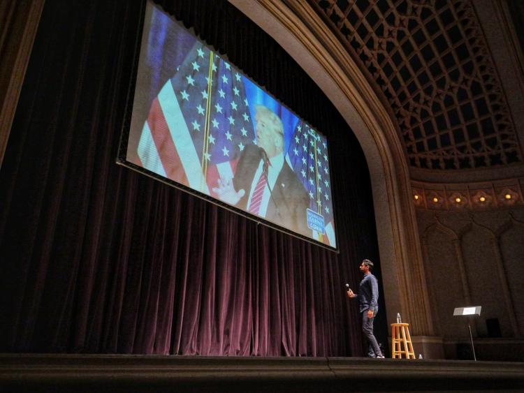 Hasan Minhaj speaks at Macky Auditorium. Photo by Glenn Asakawa.