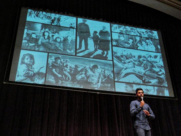 Hasan Minhaj speaks at Macky Auditorium. Photo by Glenn Asakawa.