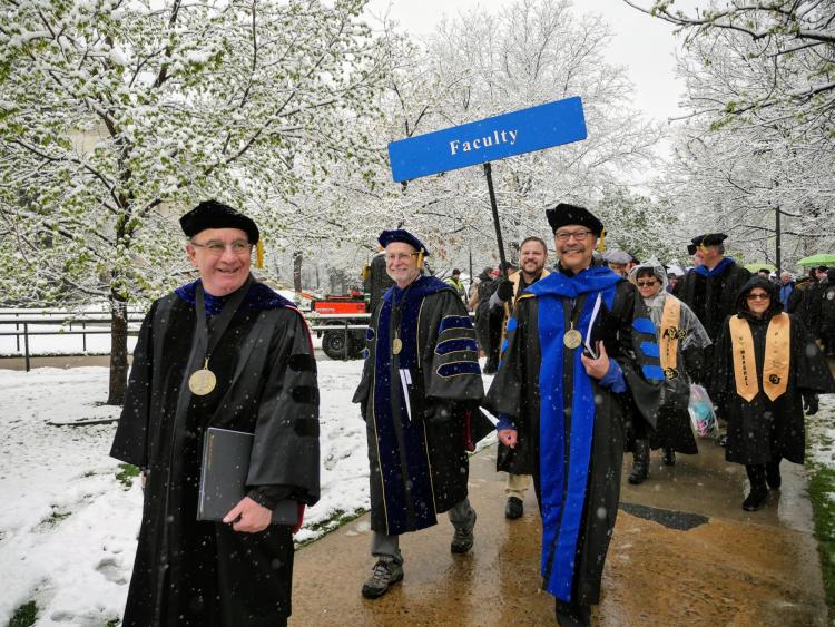Chancellor DiStefano and faculty walk in commencement procession