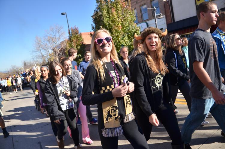Student walk in the Homecoming parade
