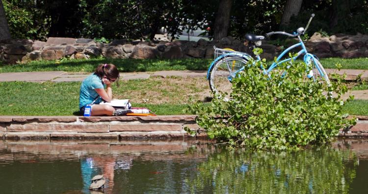 Student by lake.