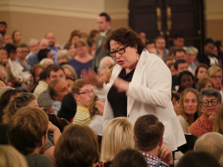 Justice Sonia Sotomayor walks through the aisles while addressing the crowd.