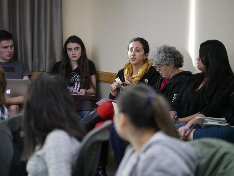Attendees have a discussion at the Diversity & Inclusion Summit in 2016.