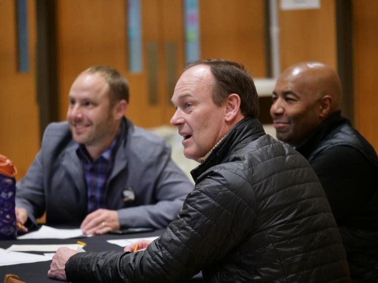 Athletic Director Rick George and Associate AD Lance Carl sit in on a Diversity and Inclusion Summit session