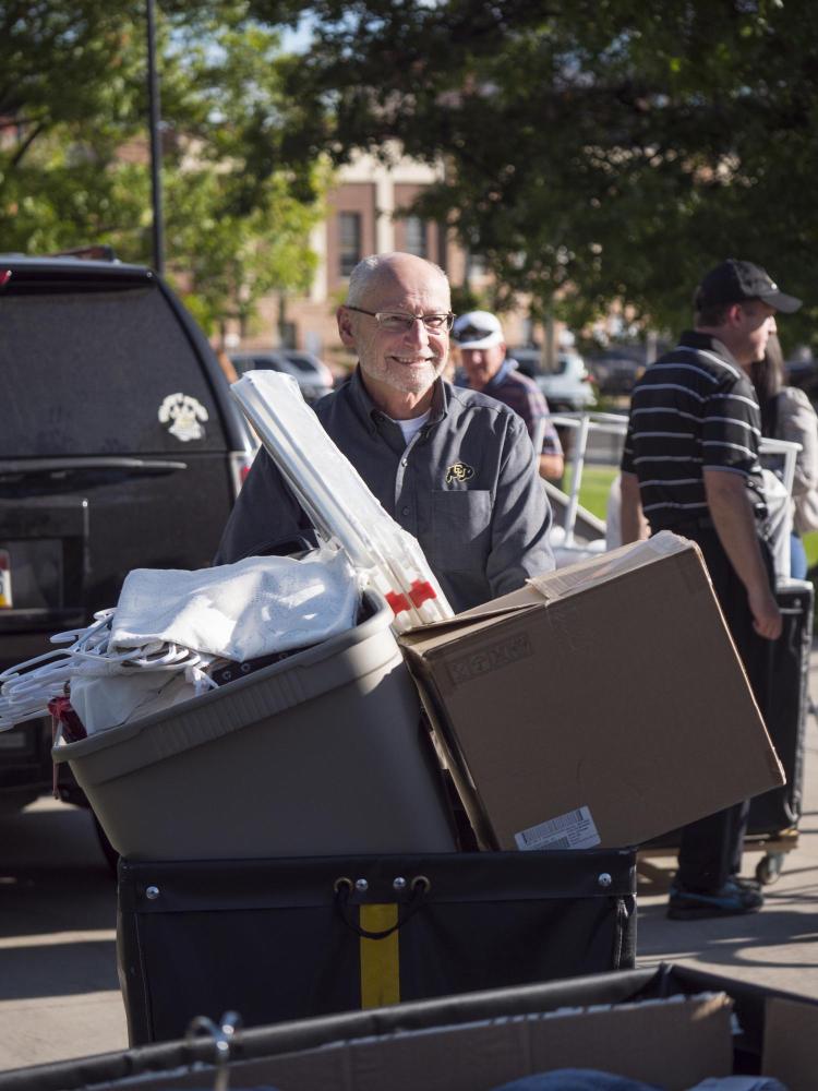 Provost Russell Moore helping students move in the residence halls