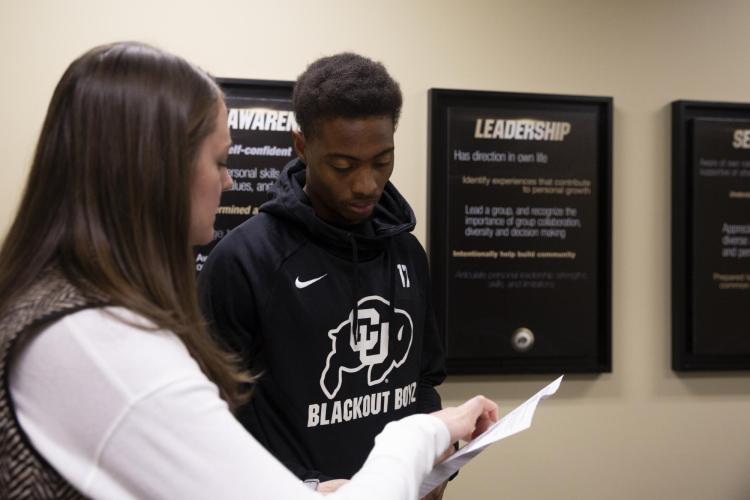 CU student-athlete Kabion Ento working with a mentor
