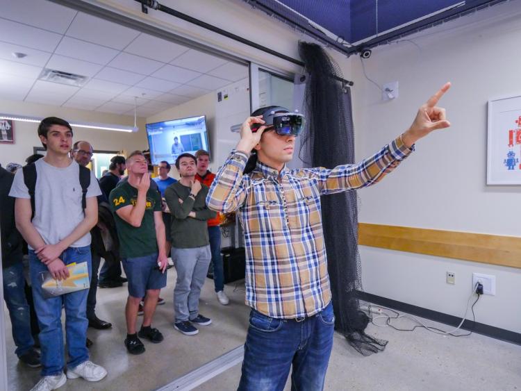 Hooman Hedayati starts up VR technology that presents a view from a drone during the ATLAS Research Showcase. Photo by Glenn Asakawa.