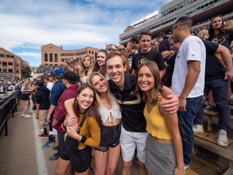 Students pose for photo at 2018 homecoming game