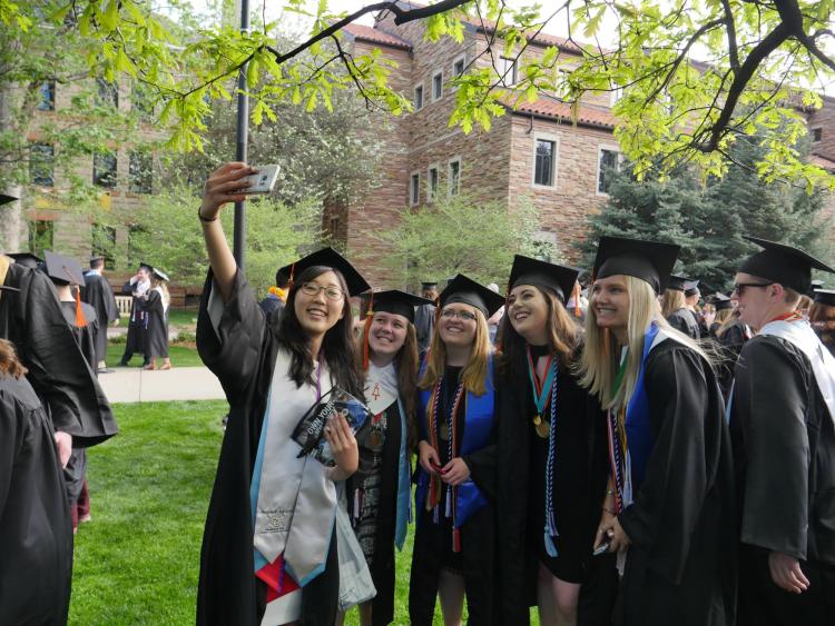 Grads gather at Norlin Quad before the main commencement ceremony. Photo by Glenn Asakawa.