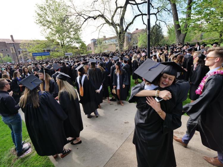 Grads gather at Norlin Quad before the main commencement ceremony. Photo by Glenn Asakawa.
