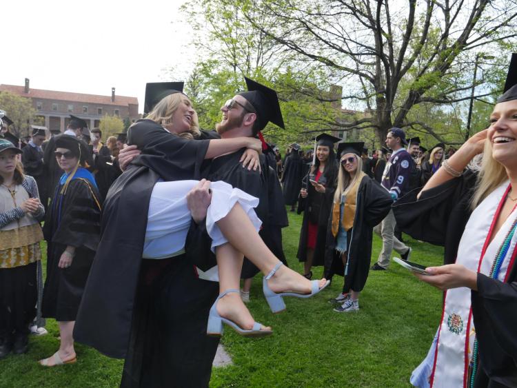 Grads gather at Norlin Quad before the main commencement ceremony. Photo by Glenn Asakawa.