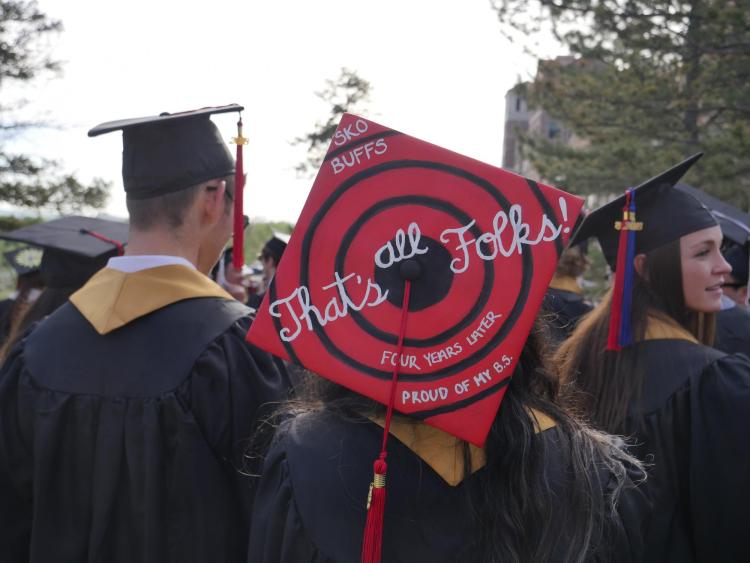 Grads gather at Norlin Quad before the main commencement ceremony. Photo by Glenn Asakawa.