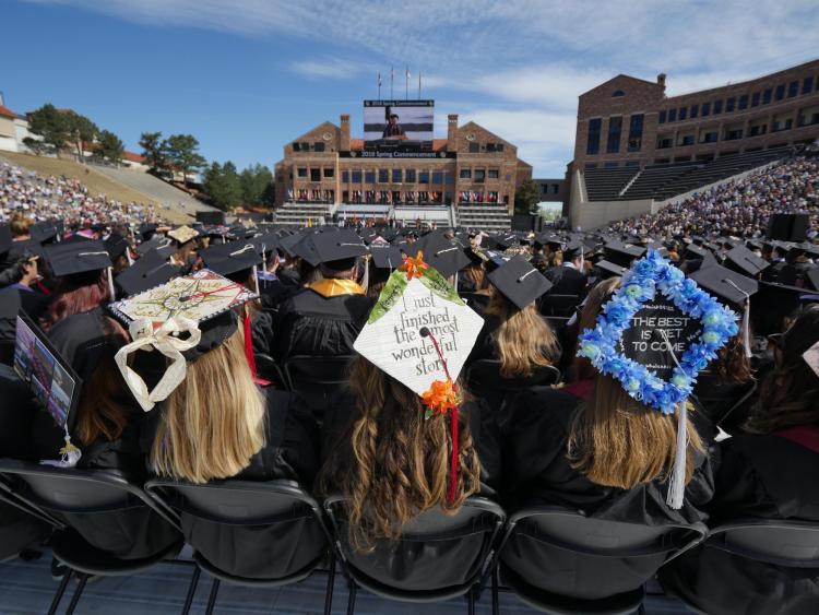 Scenes from CU Boulder's 2018 main commencement ceremony at Folsom Field. Photo by Glenn Asakawa.