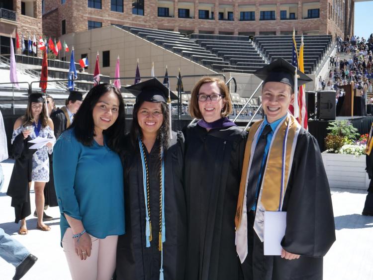 Commencement speaker Oregon Gov. Kate Brown takes photo with DACA students mentioned in her speech. Photo by Patrick Campbell.
