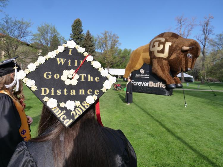 Grads gather at Norlin Quad before the main commencement ceremony. Photo by Glenn Asakawa.